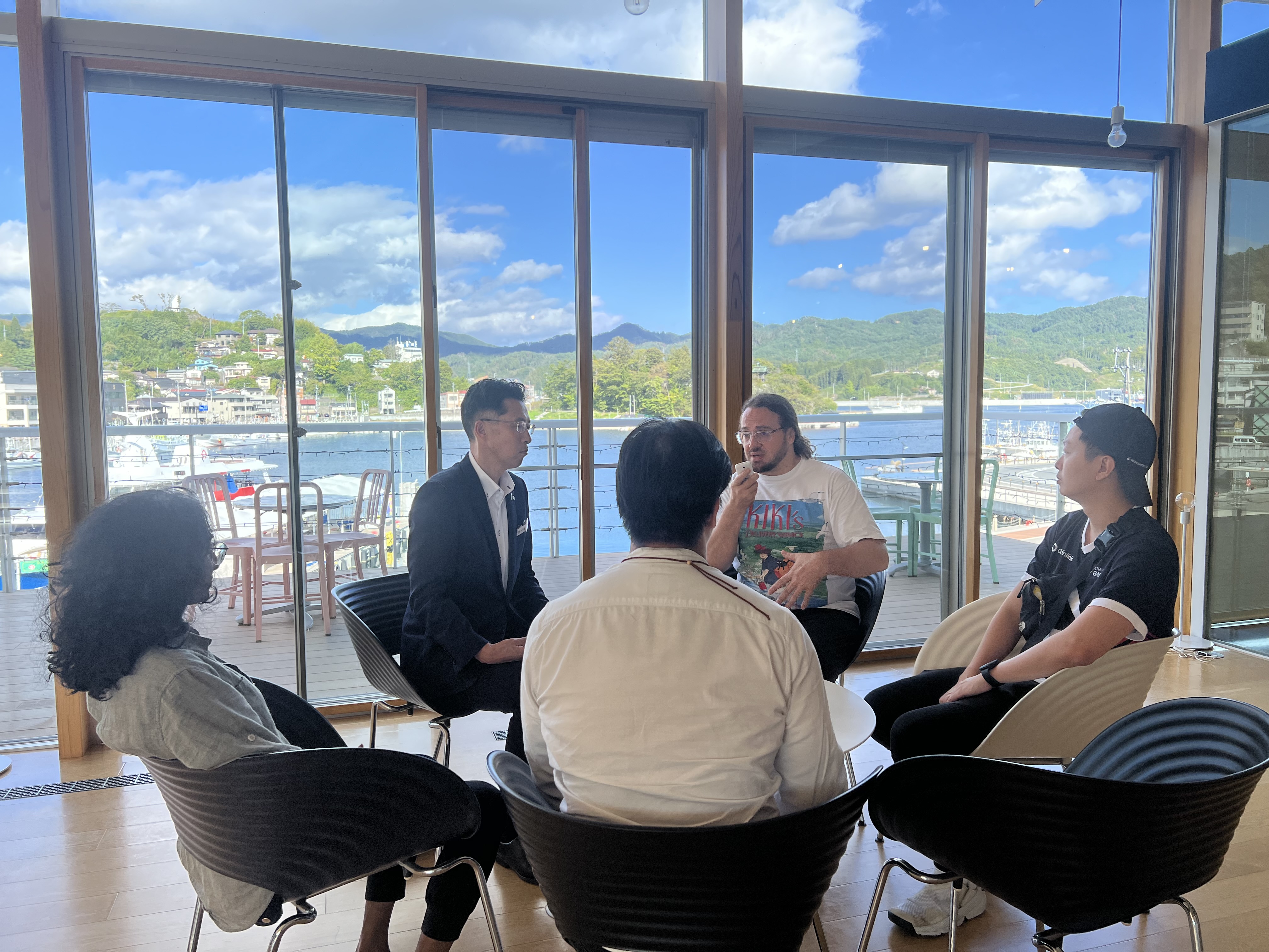 Small group discussion with harbor view